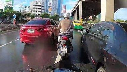 Delivery rider skids on wet road crashing into pickup truck in front