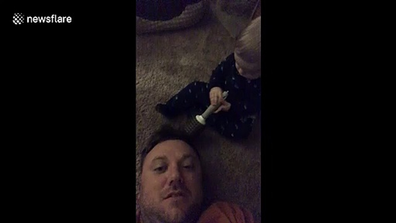 Baby boy with no chill smacks dad smack dab in the face with hairbrush