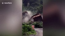 Daredevil calmly takes photos on site metres away from landslide in central China