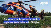 Feuerwehr löscht schwer zu erreichende Waldbrände in Sibirien