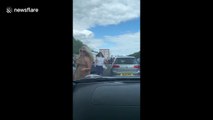Ice cream van opens to motorists stuck on UK motorway on hot day