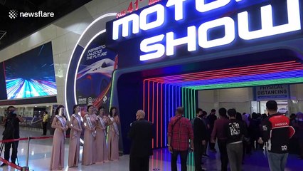Thai models don face shields at first motor show amid COVID-19 pandemic