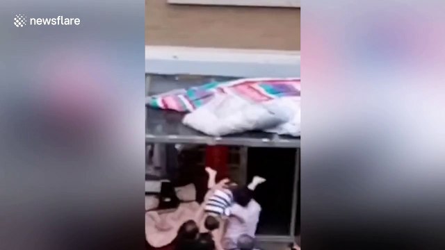 Chinese man catches toddler falling from fourth floor of residential building