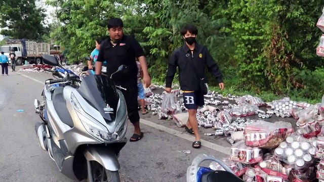 Truck Spills Hundreds Of Cans Of Beer