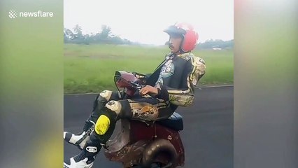 Scooter fanatics ride one-wheel vespa in Indonesia