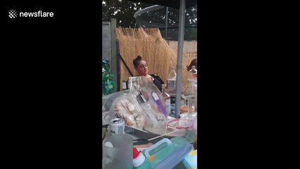 UK man lands cheese slice on women's face from across the table