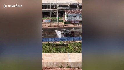 Cars queue for 'free wash' after fire hydrant bursts in southern China