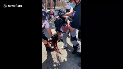 NYPD detain protesters for allegedly 'sitting down'