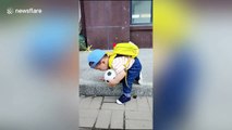 Chinese toddler is so adorably careful climbing down one step