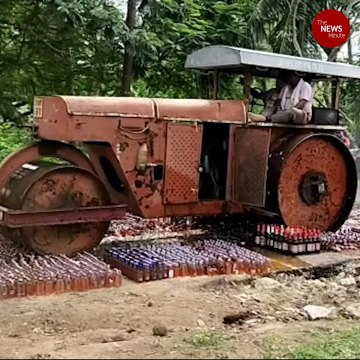 Andhra cops use road roller to destroy illegal liquor bottles seized