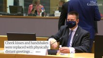 Elbow bumps and bows: masked EU leaders join physically distant summit