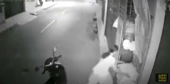 Indian girls steals bags of cement, drives away on her scooter