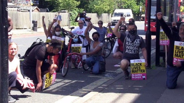 Protesters gather following UK police officer kneeling on man's neck
