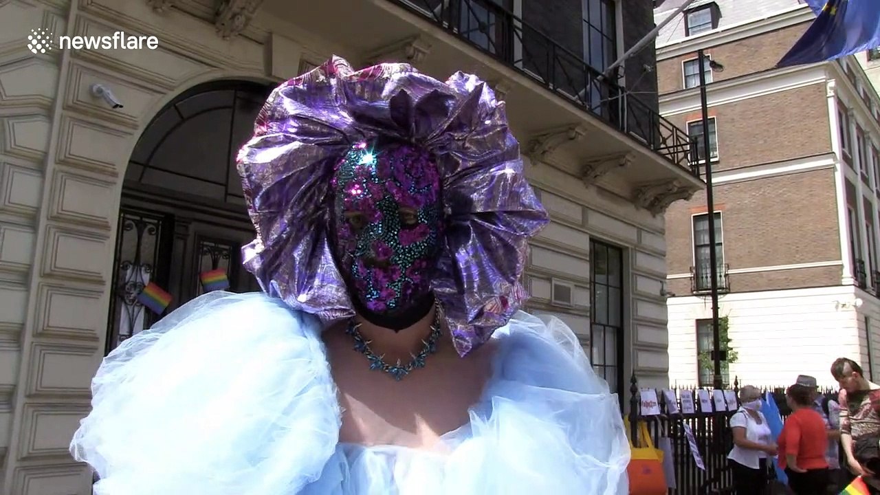LGBT rights activists cover Polish embassy doors with signs in London