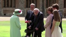 Captain Tom Moore receives knighthood from Queen