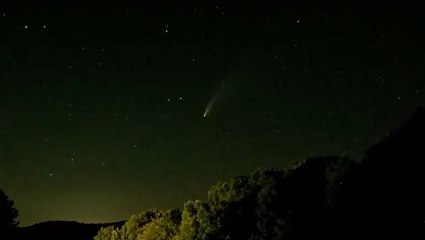 Comet spotted glowing in the night sky