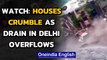 Video shows houses crumble as drain in Delhi overflows after heavy rain | Oneindia News