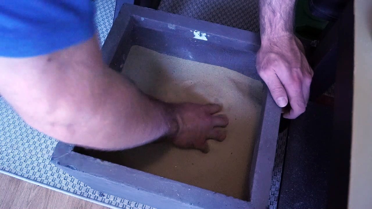 Claw strikes into sand