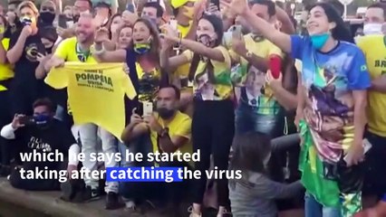 Bolsonaro meets supporters, removes mask despite COVID-19 infection