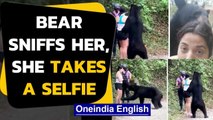 A video of a hiker taking selfie with a black bear goes viral on social media | Oneindia News
