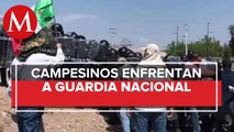 Campesinos se enfrentan con GN en Chihuahua por presa