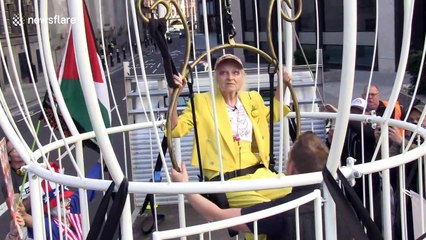 Vivienne Westwood suspends herself in giant birdcage and claims "the world is corrupt" at London protest for Julian Assange