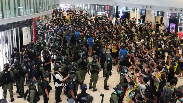Hong Kong police disperse crowds at shopping mall as protesters mark Yuen Long attack anniversary