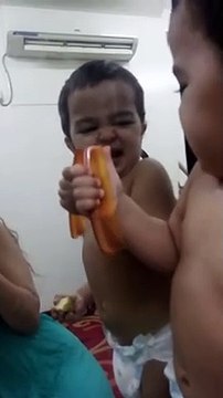 Adorable baby flexes muscles with dad in front of mirror Amazona