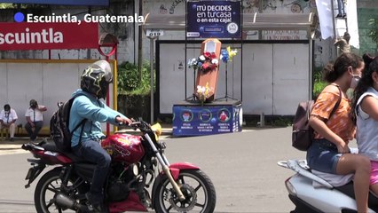 Guatemalan town places coffins in streets to warn people of the virus