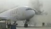 Moment huge plane bursts into flames at airport as smoke fills runway
