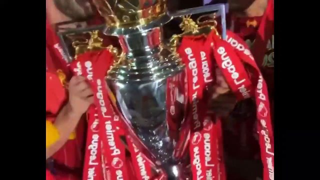 Liverpool players celebrate in dressing room after lifting the Premier League trophy in style