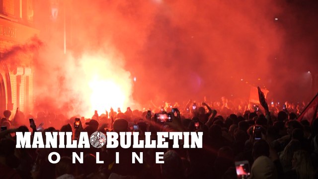 Fans celebrate outside Anfield as Liverpool lift Premier League trophy