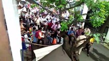 Commuters stage protest demanding to board local trains amid COVID-19 lockdown in western India
