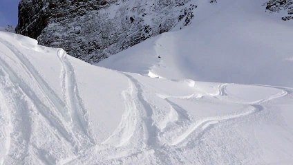 Snowmobile Stunt Ends With a Splash