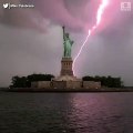 Statue of Liberty lit up by lightning