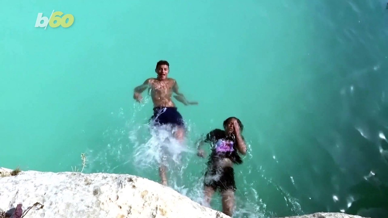 Palestinian Father & Neighbors Help Build Pool Carved into Hills and Cave to Cool Off!