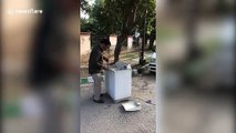 Man rescues monitor lizard after it was found in washing machine in northern India