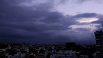 Timelapse of clouds over city