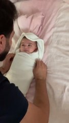 Dad Tucks Baby Into Blanket Adorably