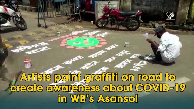 Artists paint graffiti on road to create awareness about COVID-19 in WB’s Asansol