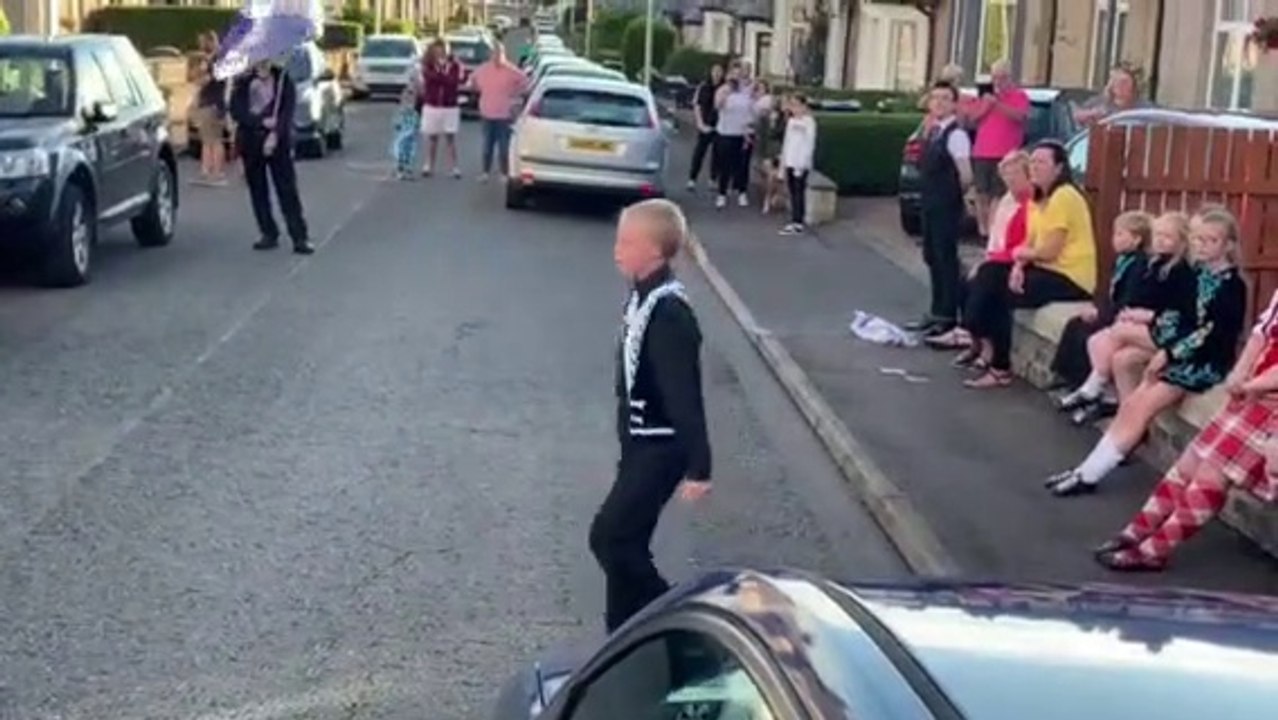 Boy dancing in street