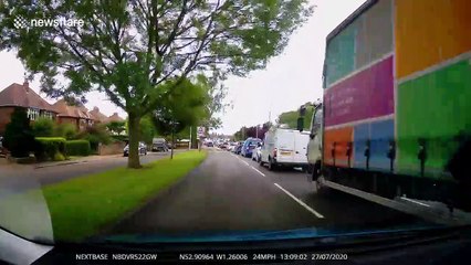 Close call during UK driving lesson as red car pulls out in front of learner