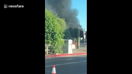 Thick smoke clouds pour from bridge in Tempe after train derails