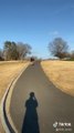 Guy Turns on Sharp Downhill Path While Longboarding and Falls Hard on Ground