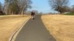 Guy Turns on Sharp Downhill Path While Longboarding and Falls Hard on Ground