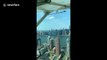 Look at New York's skyline from a different perspective as this seaplane lands in the East River