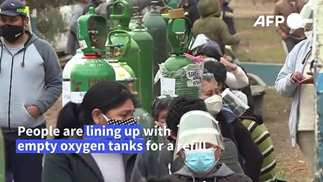 Peruvians line up to refill oxygen tanks