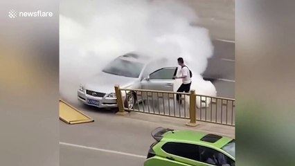 Passersby remove ill driver from burning car after crashing into guardrails in China