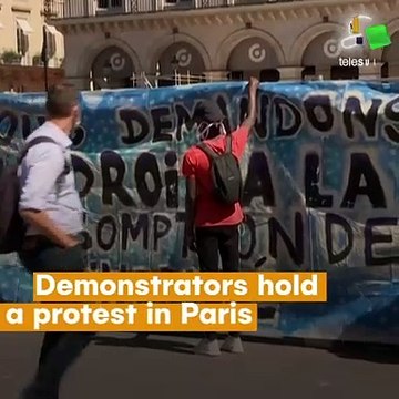 Demonstrators hold protest in Paris demanding rights for young migrants