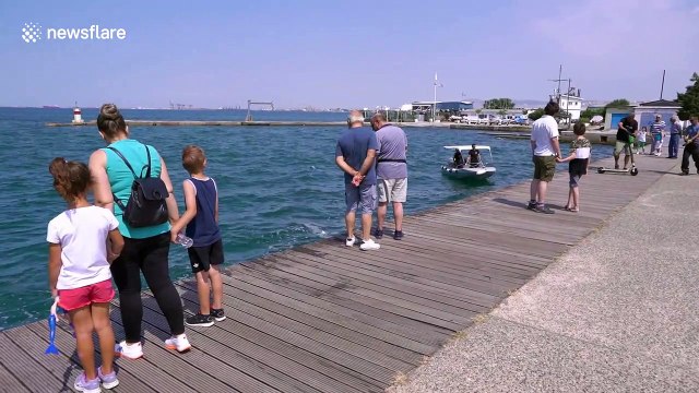 Divers retrieve dozens of electric scooters from sea near Thessaloniki, Greece